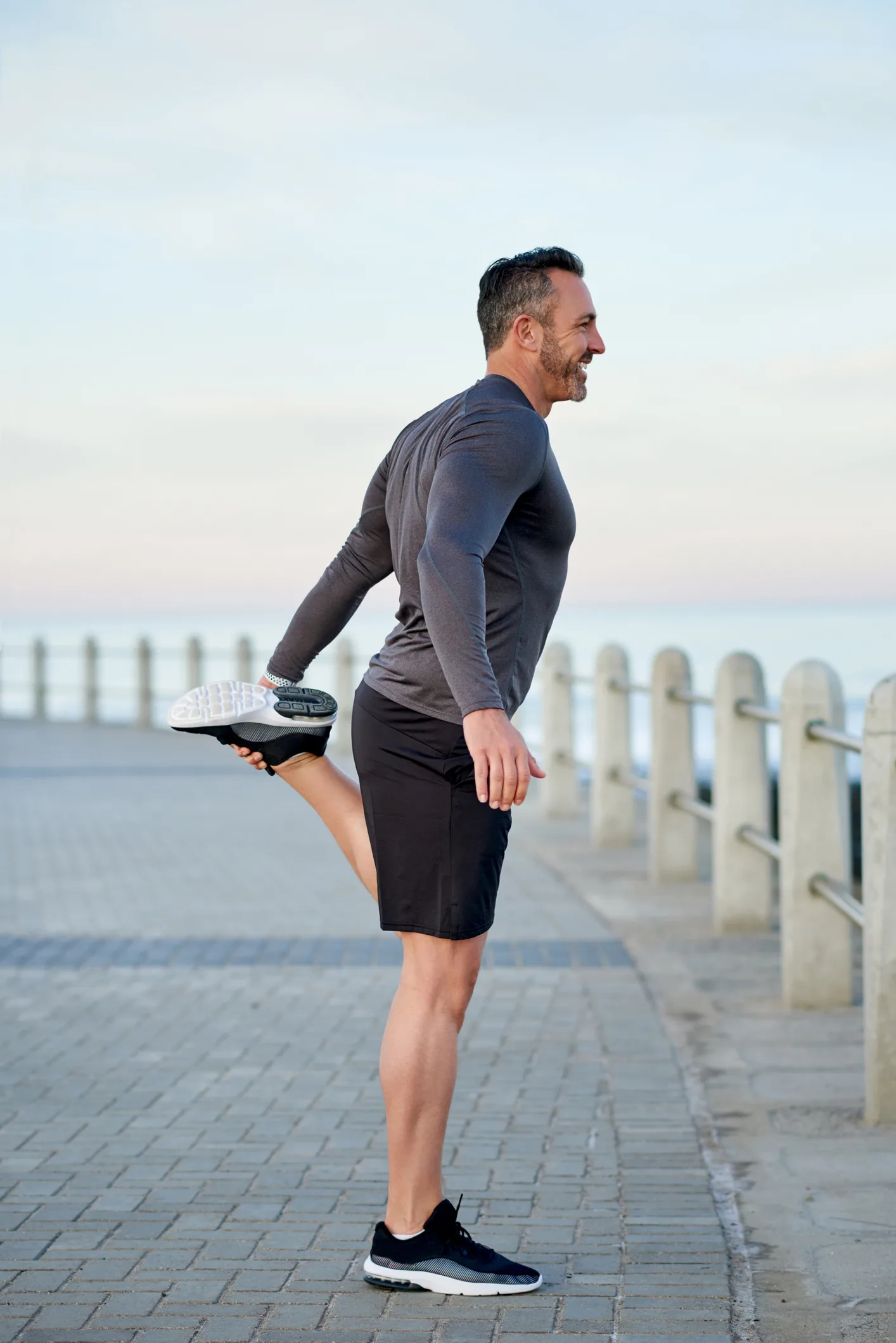 Shot of a mature man warming up before his run